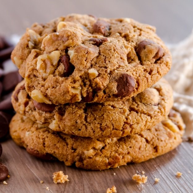 Three delicious chocolate chip cookies on top of each other